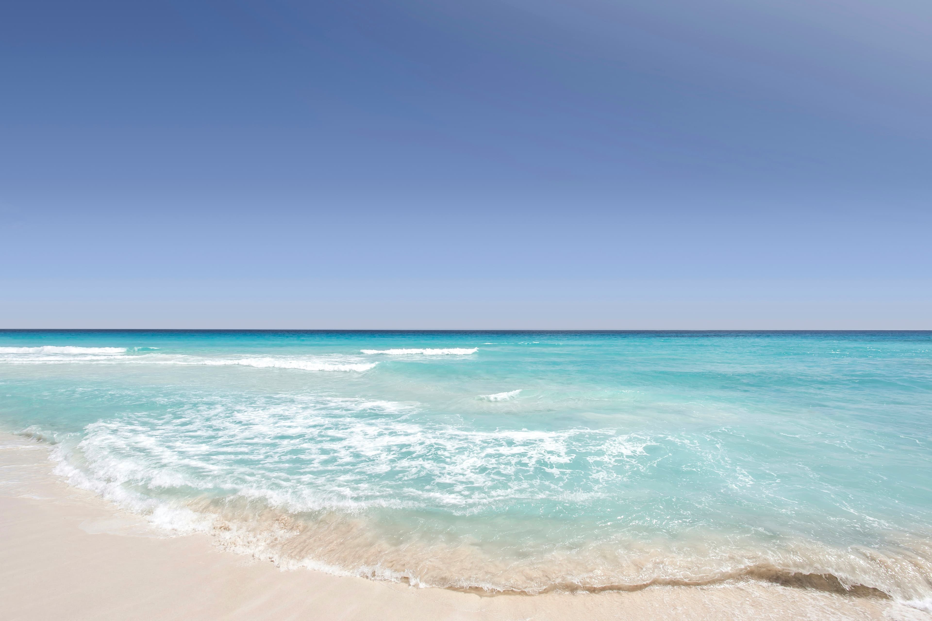 Clear blue water on a sandy beach in Cancún